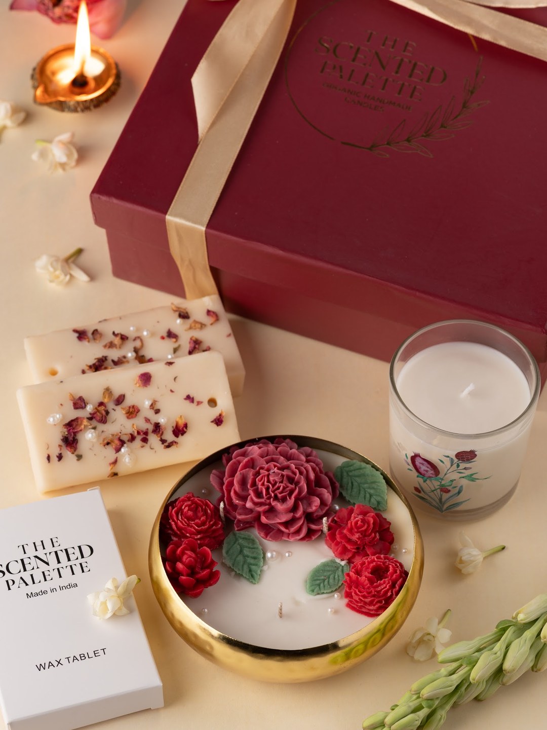 Riwayat maroon gift box with floral candle, painted votive and wax tablets
